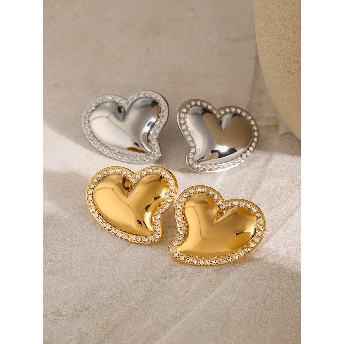 White rhinestone smooth slanted heart-shaped earrings