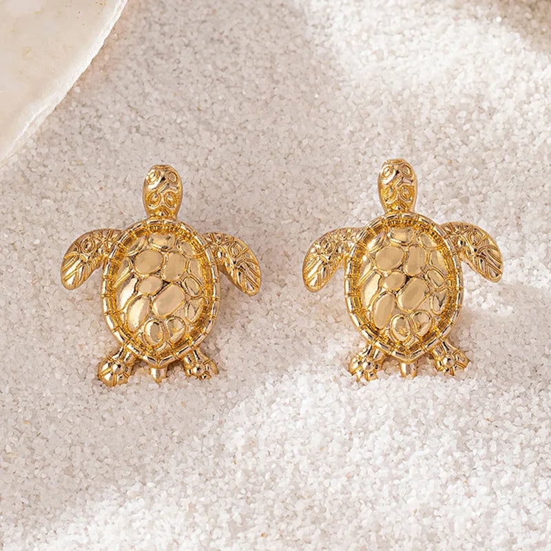 A pair of golden metallic animal turtle earrings