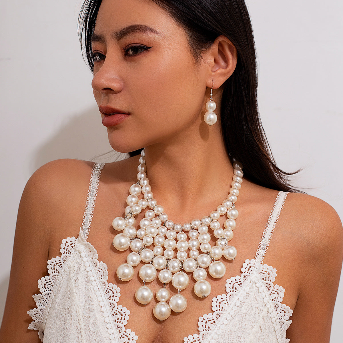 Pearl tassel necklace set with exaggerated geometric round beads and multi-layer collarbone chain